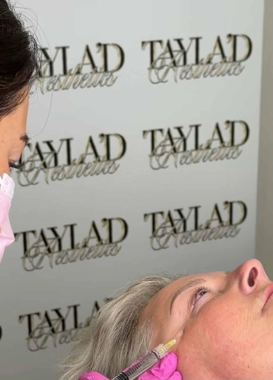 Tayla Vincent performing an aesthetics treatment in the Tayla'd Aesthetics studio